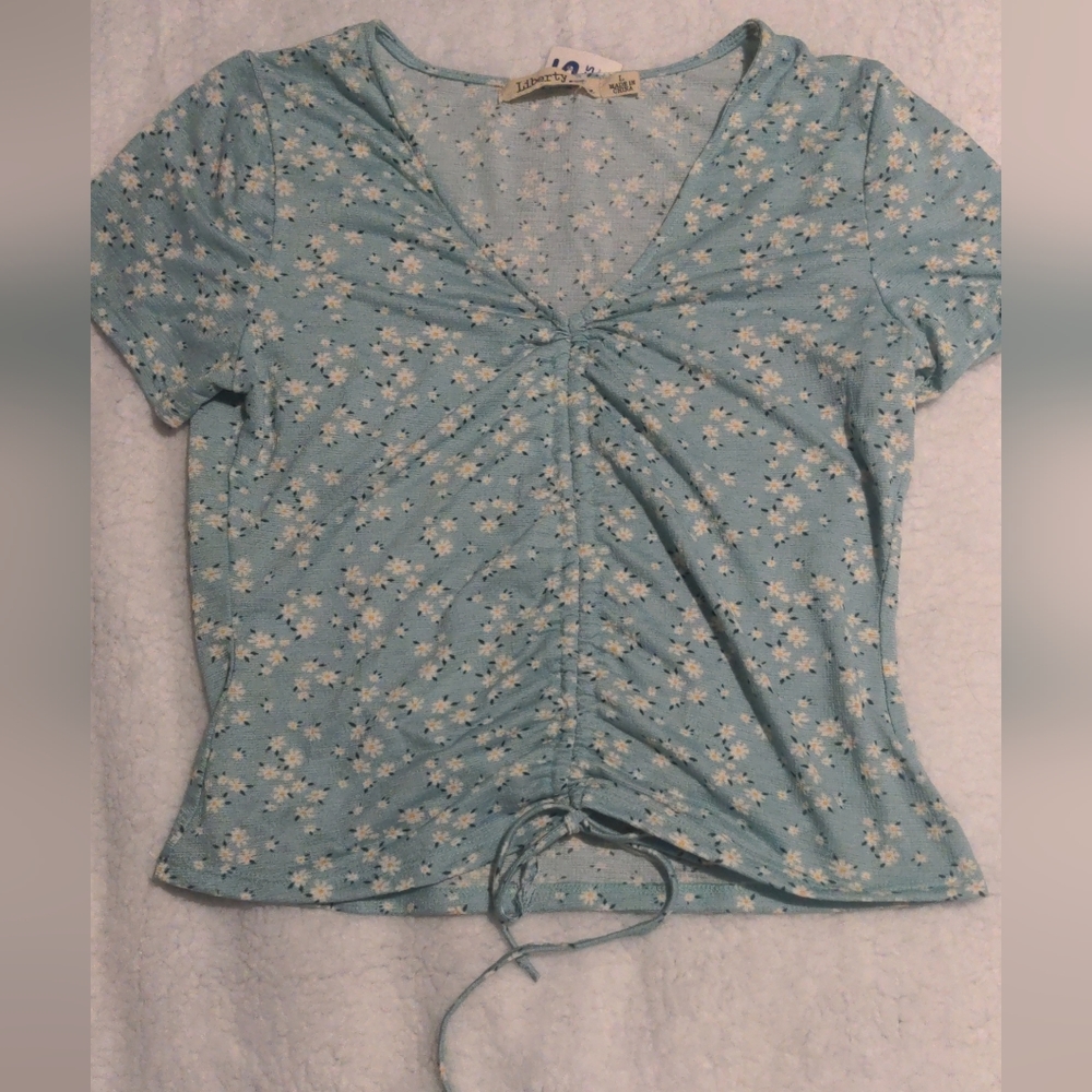 Green with daisy flowers top